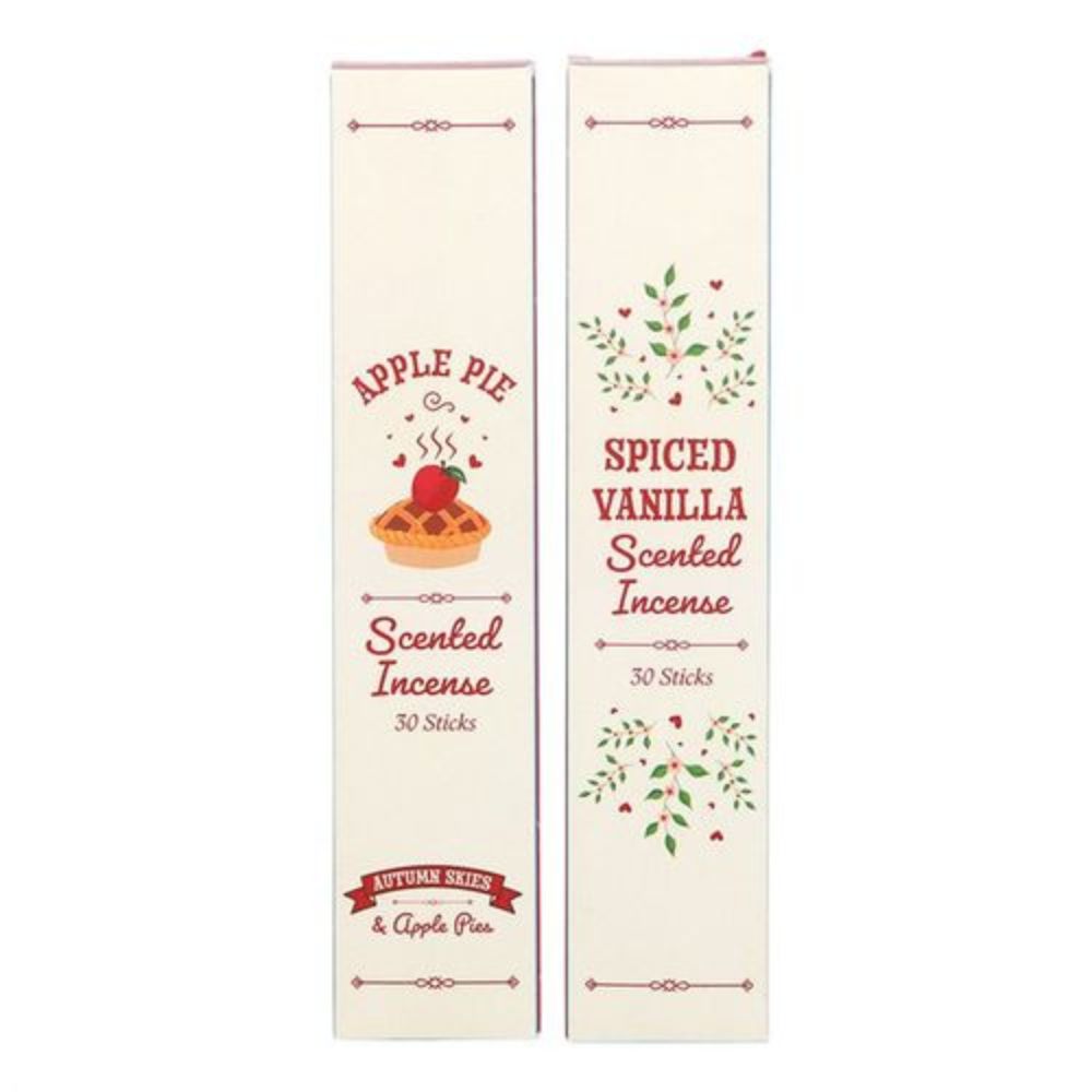Two packages of spiced vanilla and apple pie scented incense on a white background