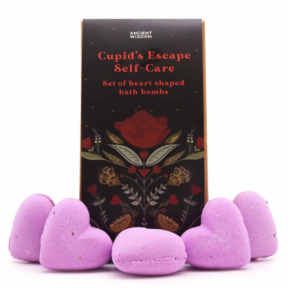 lilac heart shaped bathbombs. dark gift packaging in folk style design.