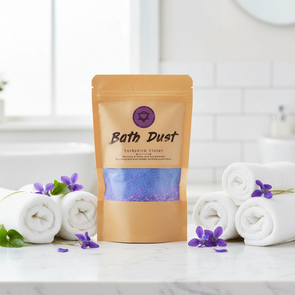 A package of Bath Dust bath add-in with shea butter, displayed in a clear window showing the product inside.