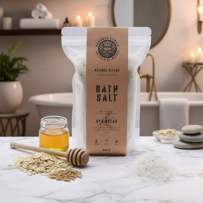 Bath salt packaging with jar of honey, wooden spoon, and oats on a white background