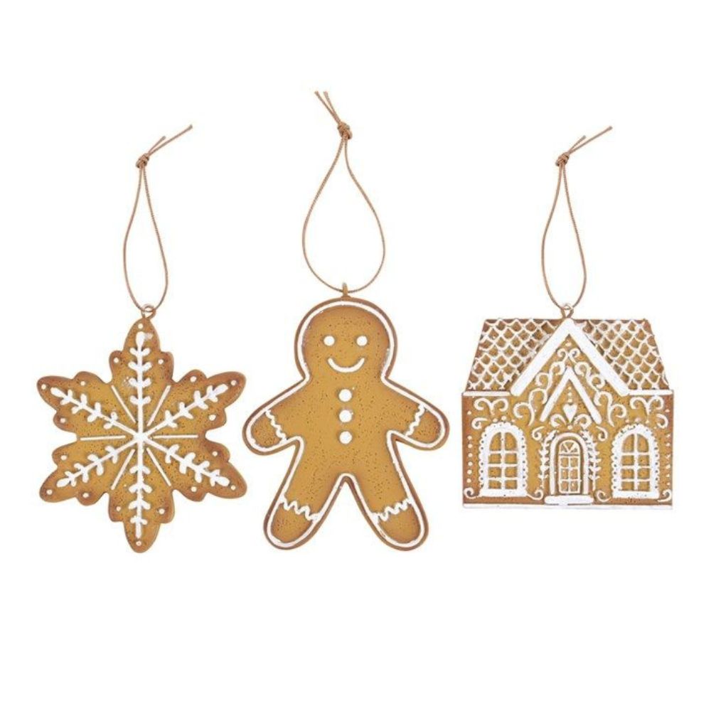 Three Christmas ornaments shaped like a snowflake, gingerbread man, and gingerbread house on a white background.