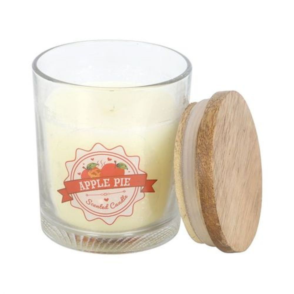 Candle in a glass jar with a wooden lid labeled 'Apple Pie' on a white background