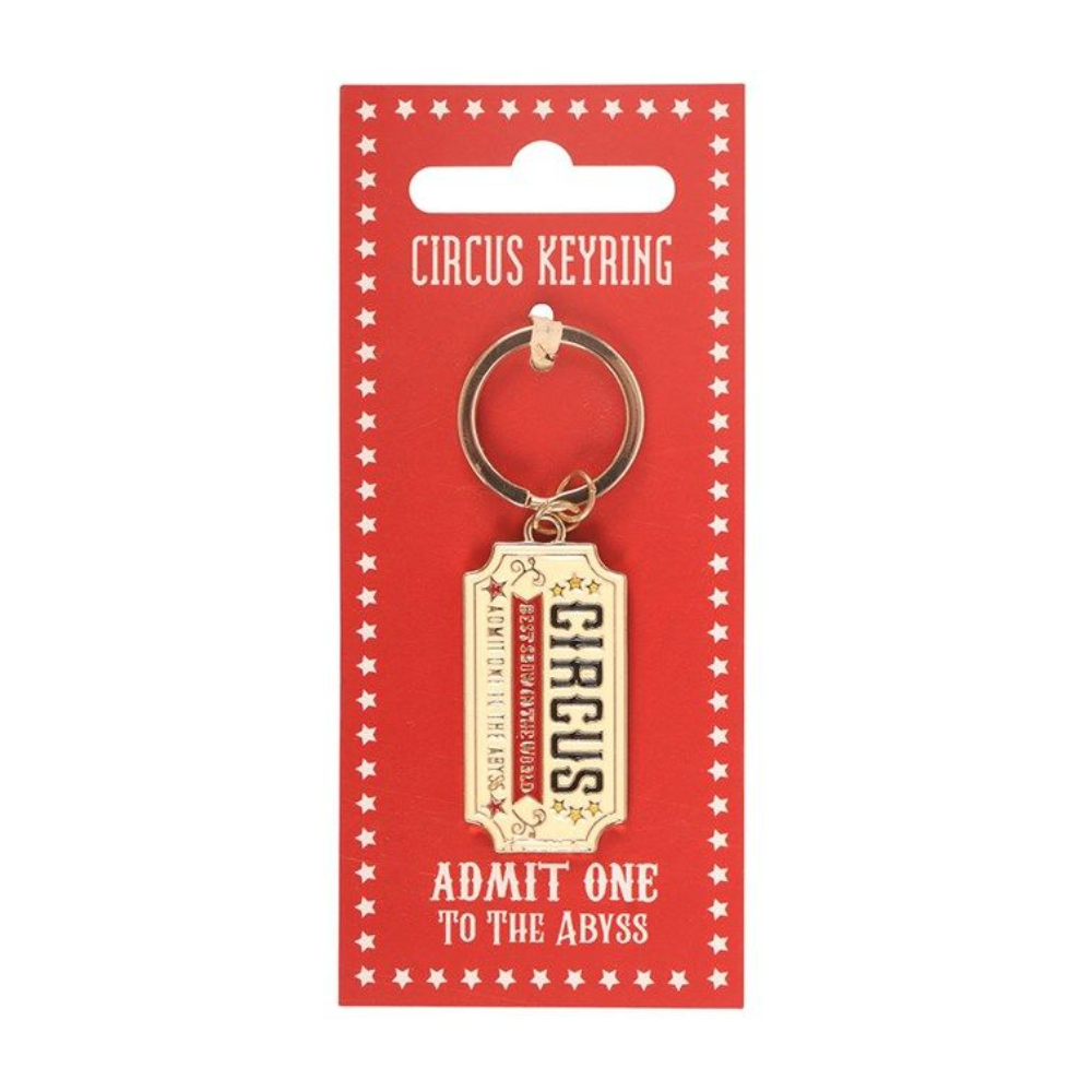 Circus keyring with 'Admit One to the Abyss' text on a red card