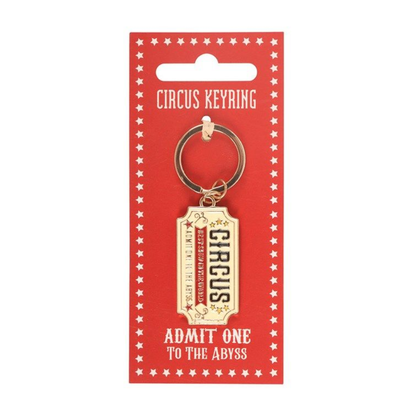 Circus keyring with 'Admit One to the Abyss' text on a red card