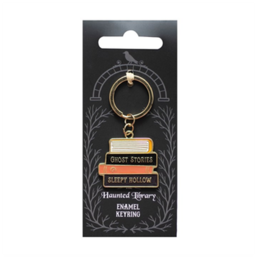 Keychain with book design on a black card with white text