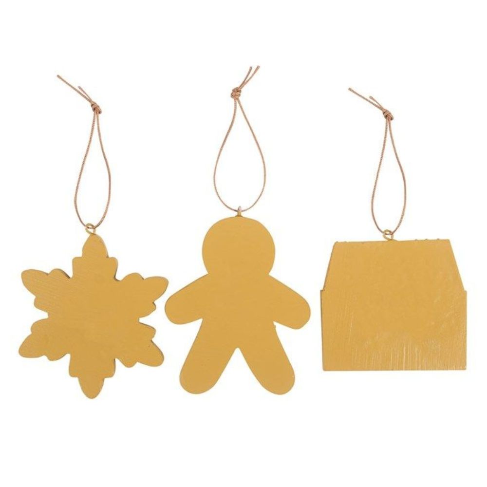 Three gold Christmas ornaments shaped like a snowflake, gingerbread man, and house on a white background.