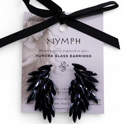 Black glass earrings on a 'Nymph' branded card with a black ribbon.