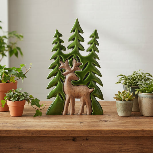 Decorative wall art with a deer and trees on a white background