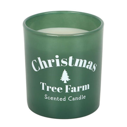 Green candle with 'Christmas Tree Farm Scented Candle' text on a white background
