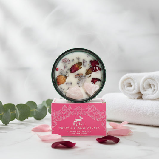 A collection of handmade candles adorned with gemstones, flowers, and wooden wicks, set in containers.