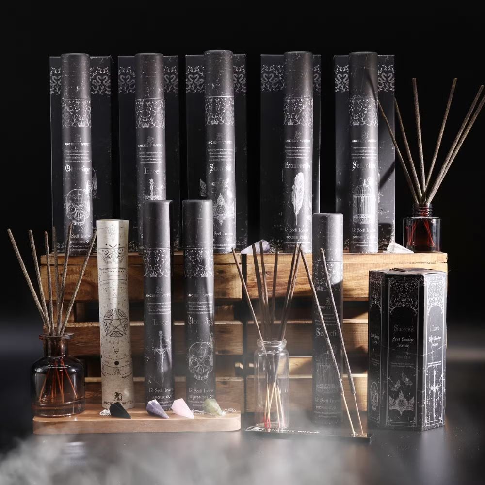 Collection of diffusers with decorative packaging on a dark background